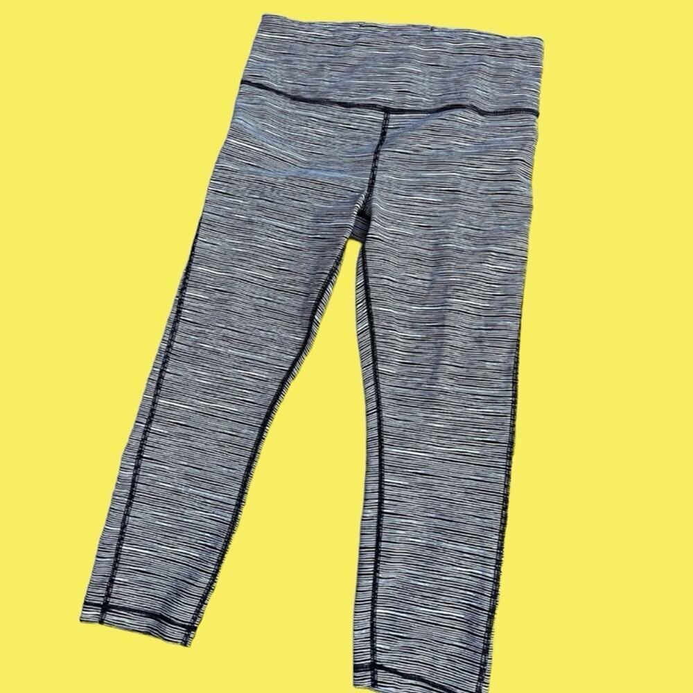 ATHLETA legging, Capri length. Black with narrow white stripes. Women's size S